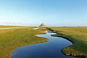 France, Manche, Mont Saint Michel bay, listed as World Heritage by UNESCO, the bay and Mont Saint Michel during fall high tides from the salted fields