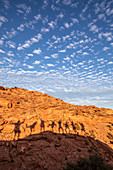 Peoples shadows on wind formed sandstone formations at Los Gatos, Baja California Sur, Mexico, North America