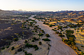 Aerial of a dry valley in the UNESCO World Heritage Site, at sunrise, Air Mountains, Niger, Africa