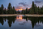 First light on the Grand Tetons with reflection at Schwabacher's Landing, Grand Teton National Park, Wyoming, United States of America, North America