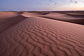 Blue hour on the Sahara Desert sand dune patterns, Erg Chebbi, Merzouga, Morocco, North Africa, Africa