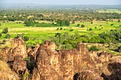 Burkina Faso, Cascades region, Sindou, country of the Senoufo ethnic group, the Sindou peaks are sandstone pitons carved by nature and a sacred place for Senoufos, sugar canne fields in the background 