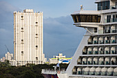 Skyscraper and front of cruise ship World Dream, Manila, National Capital Region, Philippines, Asia