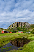 Red houses in front of Torghattan, Bronnoysund, Norway