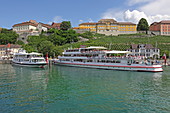 View over the harbor to the Staatsweingut and the Gymnasium Meersburg, Baden-Württemberg, Germany