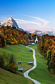 View of the church village Wamberg, with Zugspitze Waxenstein and Daniel in the background, Werdenfelser Land, Bavaria, Germany