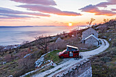 Road trip Croatia, in the evening with the camper on the coast