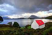 Loch Shieldaig Applecross, cottage with bright red roof, Wester Ross, Scotland UK