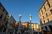 Columns on the Piazza dei Signori with statues, on the left the Lion of St. Mark, on the right &#39;Il Redentore&#39;, Vicenza, Veneto; Italy.
