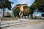 USA, California, San Francisco, Man skateboarding at skate park