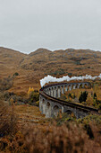 Smoke emitting from train on Glenfinnan Viaduct, Scotland