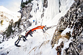 Ice tools in the snow, ice climbing training in the Allgäu near Vilsalpsee on the Traunalpfall