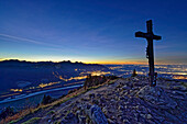 Night mood on the Heuberg with summit cross and deep view of the Inn Valley and illuminated places of the Rosenheimer Land, Heuberg, Chiemgau Alps, Upper Bavaria, Bavaria, Germany