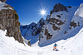 Woman on ski tour climbs into the Schinderkar, Schinder, Spitzing area, Bavarian Alps, Upper Bavaria, Bavaria, Germany