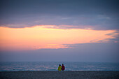 Evening mood with couple at the North Sea, Denmark