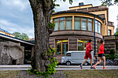 Jogger in front of Museum Aboa vetus and Ars nova, Turku, Finland