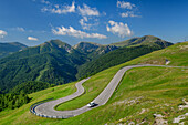 Car drives through hairpin bend on Nockalmstrasse, Nockalmstrasse, Nockberge, Nockberge-Trail, UNESCO Biosphere Park Nockberge, Gurktal Alps, Carinthia, Austria