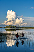Two boys on the shore in Patvinsuo National Park, Finland