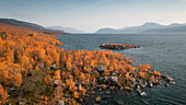 Landscape with mountains and lake in Stora Sjöfallet National Park in autumn in Lapland in Sweden from above
