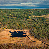 Wild landscape with forest and lake in autumn in Jämtland in Sweden from above
