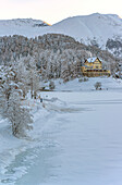 Hotel Waldhaus am See in a winter landscape on Lake St.Moritz, St.Moritz, Graubuenden, Switzerland