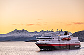 The northbound Hurtigrute MS Polarlys at the Arctic Circle, Nordland, Norway, Europe