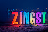 Colorful letters with the lettering Zingst, behind it the pier with the diving gondola, Zingst, Mecklenburg-West Pomerania, Germany