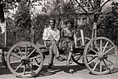 Couple sitting on a wagon, Gyor, Hungary