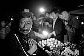 China, Hong Kong, Portrait of senior man at night market