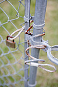 Close up of lock on chain link fence