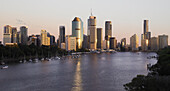 Looking across Brisbane River to high rise buildings of Brisbane City Centre, in the late afternoon