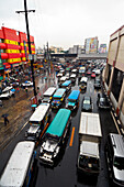Four lanes of traffic in the streets of Manila City - Philippines