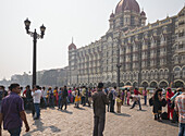 People outside the Taj Mahal Hotel In Mumbai