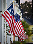 American flags fly on small town street