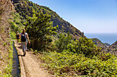 Levada do Moinho near Ponta do Sol, hikers (model released)
