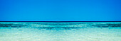 Panorama where tropical sea meets the blue sky on the horizon