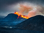 Steam cloud and glowing lava ejected from Fagradalsfjall Volcano, Iceland