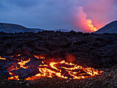 Glowing lava and Fagradalsfjall Volcano, Iceland