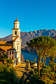 Church of Saints Fedele and Simone and Lake Lugano with Mountain in a Sunny Day in Vico Morcote, Ticino in Switzerland.