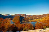 Mountain Range on the Border to Italy on Lake Lugano with Snow and Sunlight on a Clear Sky in Caslano, Ticino in Switzerland.