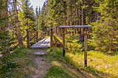 Sign Grosse Ohe and Hozbrücke in the forest in summer in the Bavarian Forest in Lower Bavaria.