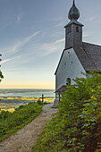 Schnappenkirche at sunrise in the background you can see the Chiemsee. Chiemgau Alps, Chiemgau, Upper Bavaria, Bavaria, Germany