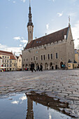 Tallinn Town Hall Square. puddle in the foreground. Reflection. Estonia, Baltic States.