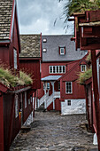 Alley with red wooden houses. Tinganes, Torhavn, Streymoy, Faroe Islands