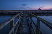 Small bridge over Pril to the Westerhever lighthouse. Eiderstedt, North Frisia, Schleswig-Holstein, Germany.