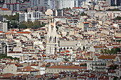 View from the Sanctuary of Notre-Dame-de-la-Garde over the rooftops of Marseille and the Church of St. Vincent de Paul, Marseille, Bouches-du-Rhone, Provence-Alpes-Cote d'Azur, France