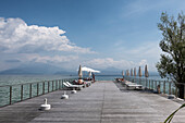 View of the jetty at the restaurant al Molo in Sirmione, Verona District, Veneto, Italy