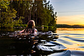 Cooling off in the lake after a visit to the sauna, Finland
