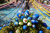 Easter fountain decorated with colorful Easter eggs in Bieberbach, largest Easter fountain in the world, in Franconian Switzerland, Bavaria, Germany