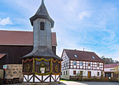 Fountain house decorated with colorful Easter eggs with Easter crib in Birkenreuth in Franconian Switzerland, Bavaria, Germany